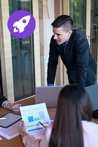 A man giving a talk to his colleagues at work