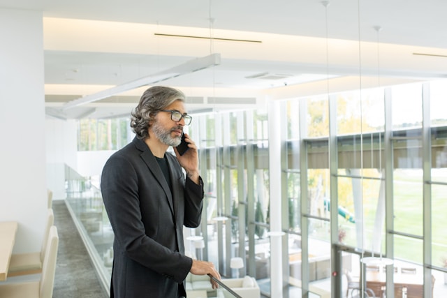 A senior office employee on the phone